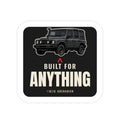 Built for Anything die-cut sticker: a boxy 4x4 wagon over a red accent mark and bold BUILT FOR ANYTHING lettering on a black badge