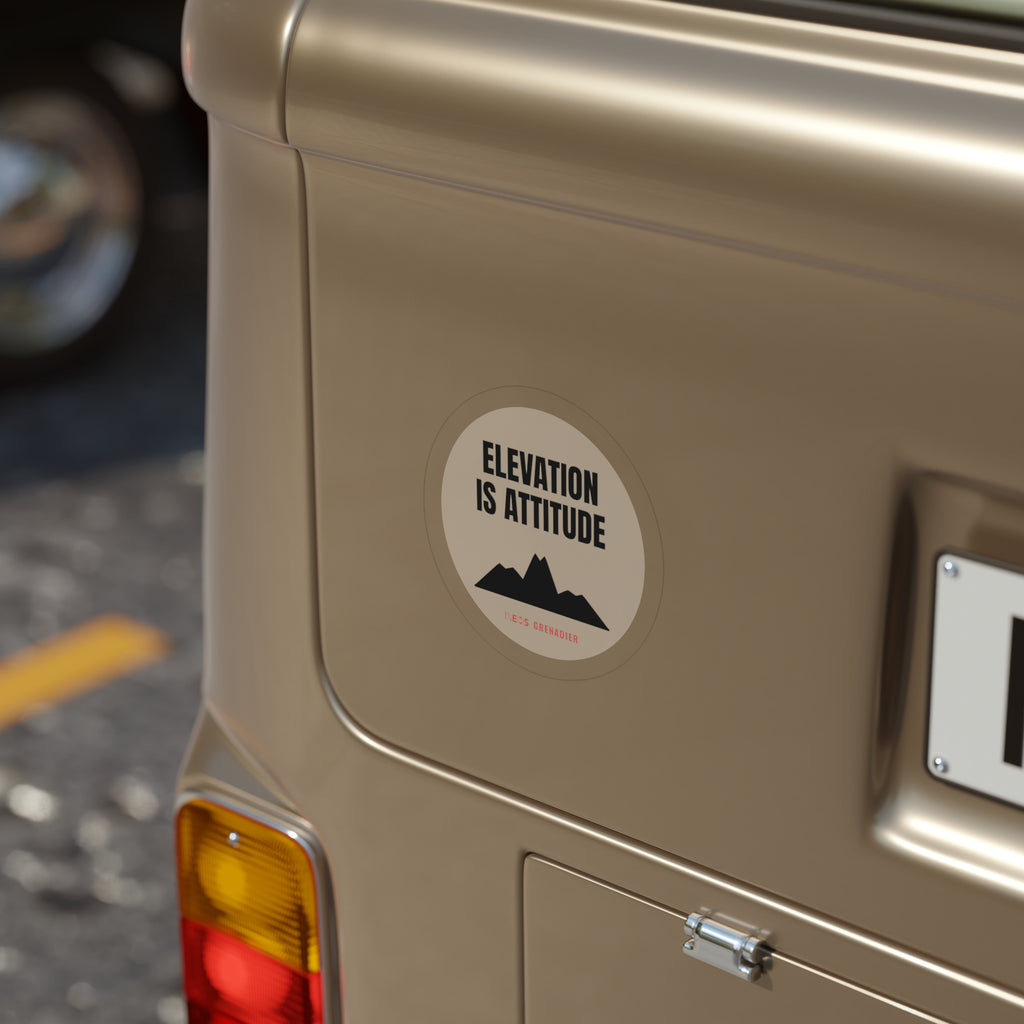 Elevation Is Attitude die-cut sticker: ELEVATION IS ATTITUDE lettering over a black mountain on a round cream badge – view 8