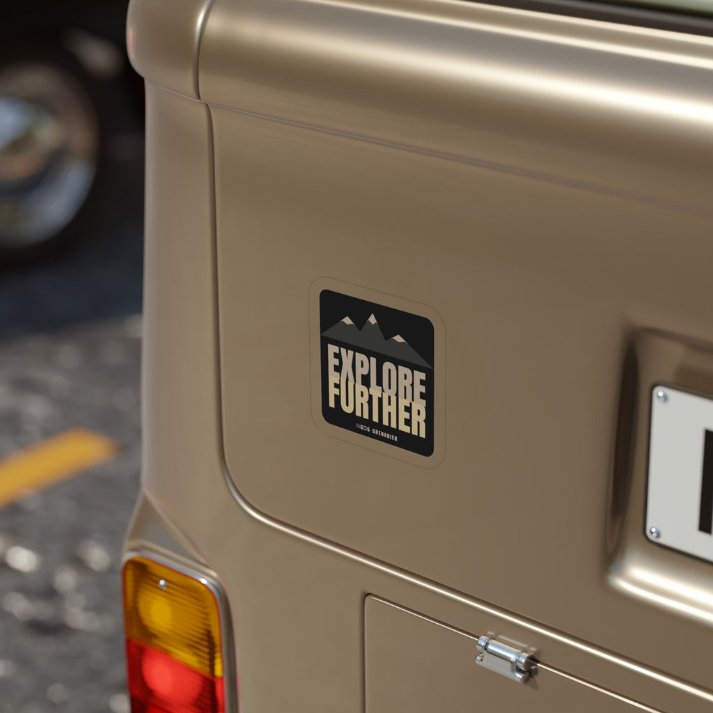 Explore Further die-cut sticker: mountain peaks above big EXPLORE FURTHER lettering in cream and tan on a black badge – view 6