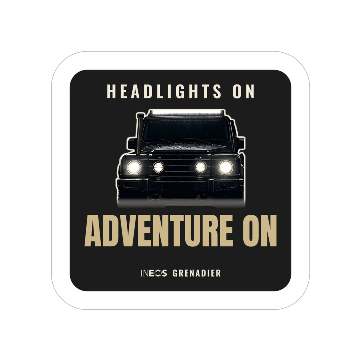 Headlights On / Adventure On die-cut sticker: a head-on 4x4 with glowing headlights between HEADLIGHTS ON and ADVENTURE ON lettering on black