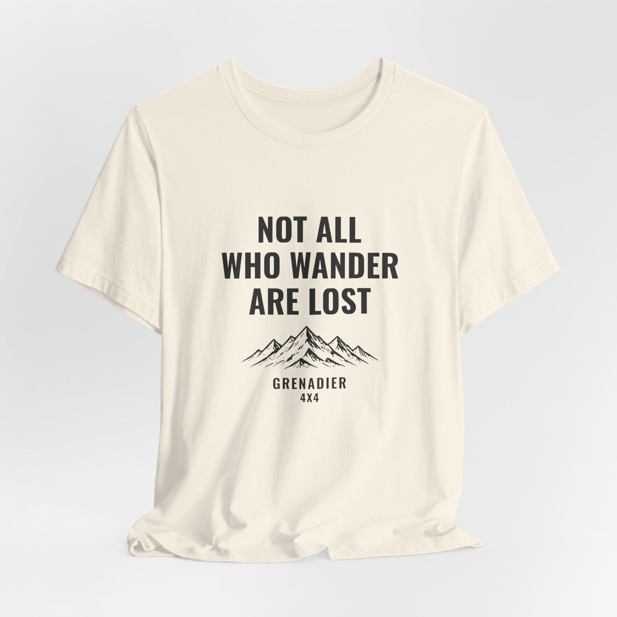 Not All Who Wander Are Lost overland tee with mountain range art, Bella+Canvas 3001 in Natural, hanging 1 view