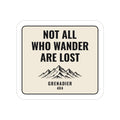 Not All Who Wander Are Lost die-cut sticker with mountains on a cream badge