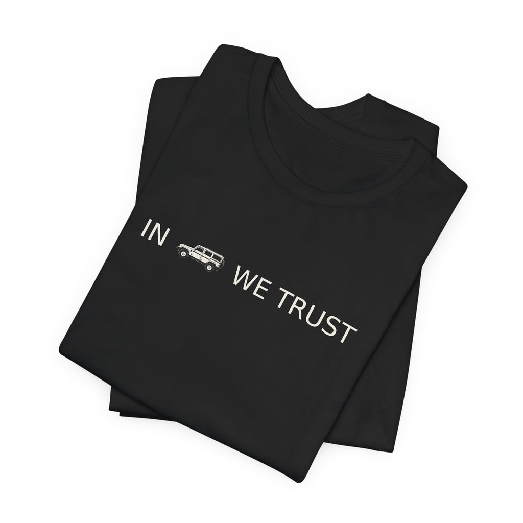 Tee with full-front IN WE TRUST lockup, side-view boxy 4x4 between the words – view 9