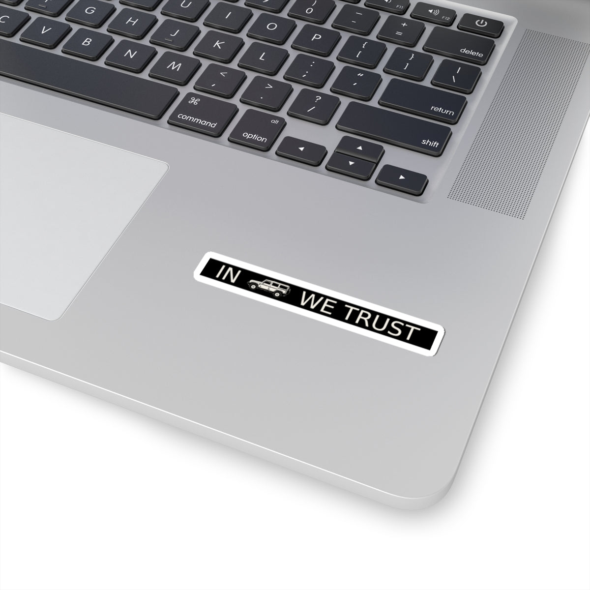 Rectangular sticker reading IN WE TRUST with side-view boxy 4x4 between the words – view 3