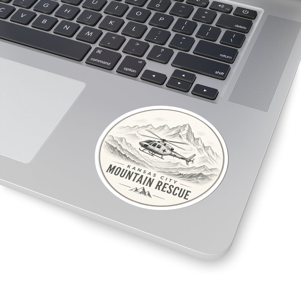 Round sticker: Kansas City Mountain Rescue, helicopter flying past sketched mountain range – view 3