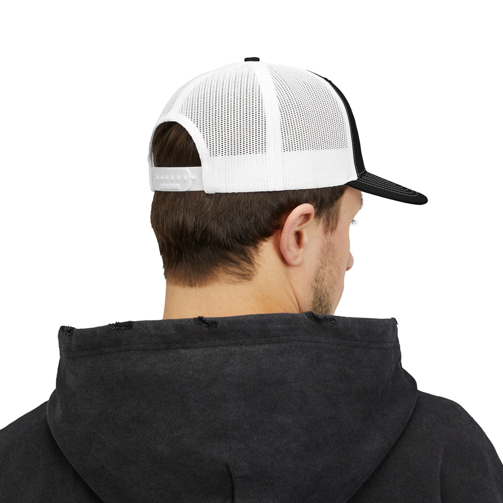 Richardson trucker hat with embroidered IN WE TRUST lockup, side-view boxy 4x4 between the words – view 8
