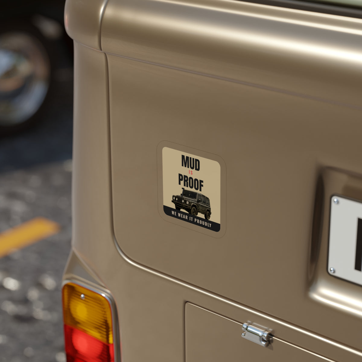 Mud Is Proof die-cut sticker: MUD IS PROOF lettering over a dark 4x4 wagon with a WE WEAR IT PROUDLY footer on a tan badge – view 6