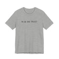 Tee with full-front IN WE TRUST lockup, front-view boxy 4x4 between the words, Athletic Heather