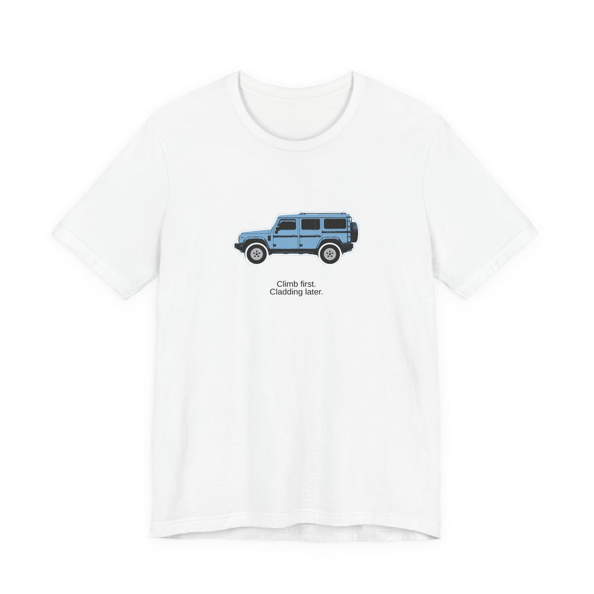 Tee: Eldoret Blue boxy 4x4 in side profile on white field, "Climb first. Cladding later." lettering under the truck, White