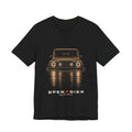 Black tee, front print: 4x4 wading dark water at night, headlights on (warm sepia tones) with LIGHTS ON. WATER UP. lettering under GRENADIER wordmark, Black