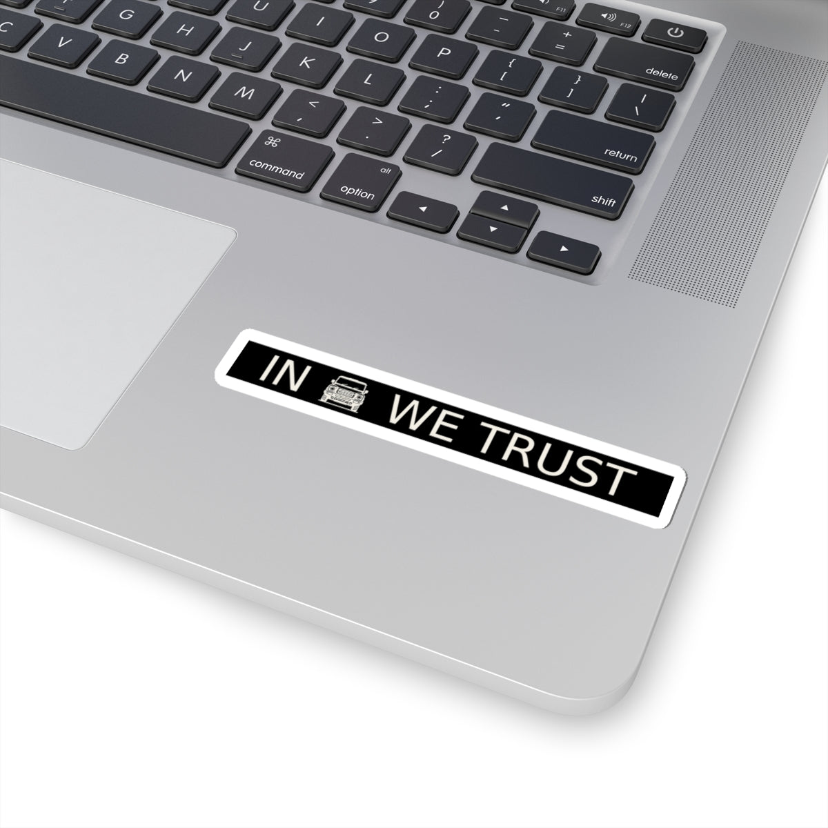 Black rectangular plate sticker reading IN WE TRUST with front-view boxy 4x4 – view 5