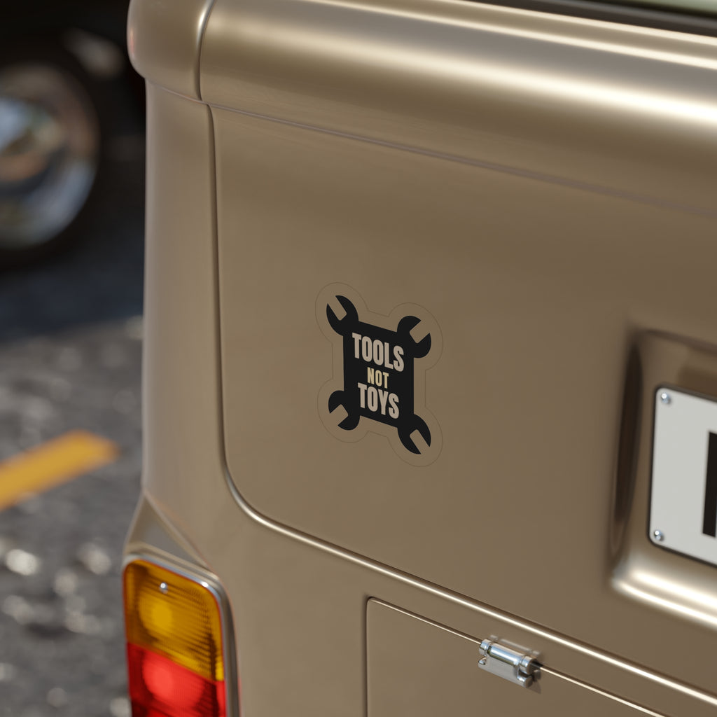 Tools Not Toys die-cut sticker: TOOLS NOT TOYS lettering on a black crossed-wrench shape – view 6
