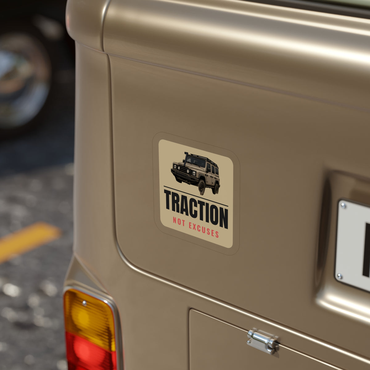 Traction Not Excuses die-cut sticker: a 4x4 wagon above bold TRACTION lettering and a red NOT EXCUSES line on a tan badge – view 8