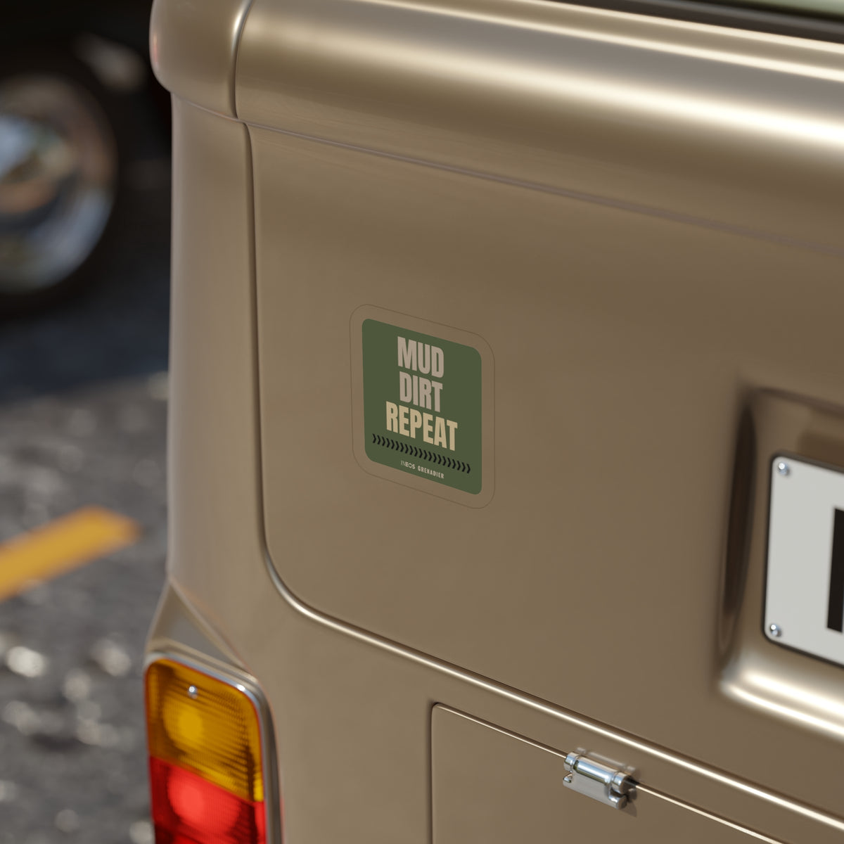 Mud. Dirt. Repeat. die-cut sticker: stacked MUD. DIRT. REPEAT. lettering over a tire-tread chevron strip on an olive green badge – view 4