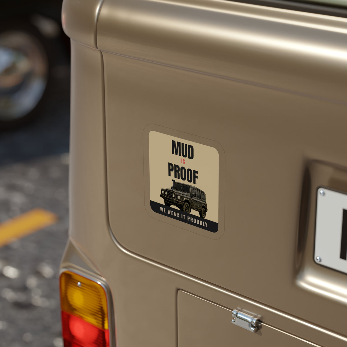 Mud Is Proof die-cut sticker: MUD IS PROOF lettering over a dark 4x4 wagon with a WE WEAR IT PROUDLY footer on a tan badge – view 8