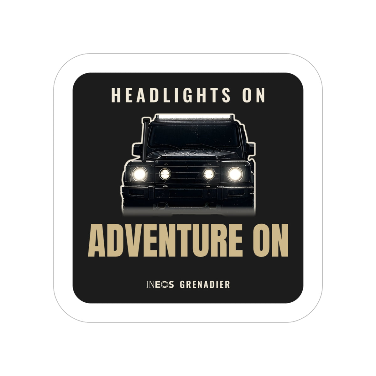 Headlights On / Adventure On die-cut sticker: a head-on 4x4 with glowing headlights between HEADLIGHTS ON and ADVENTURE ON lettering on black – view 3