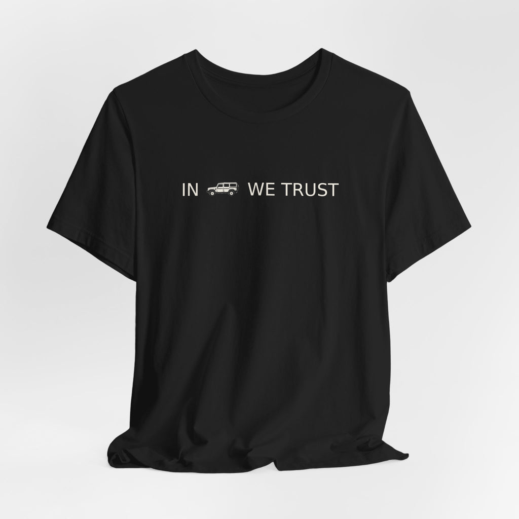 Tee with full-front IN WE TRUST lockup, side-view boxy 4x4 between the words – view 10
