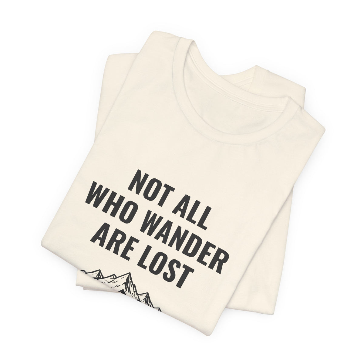 Not All Who Wander Are Lost overland tee with mountain range art, Bella+Canvas 3001 in Natural, folded view
