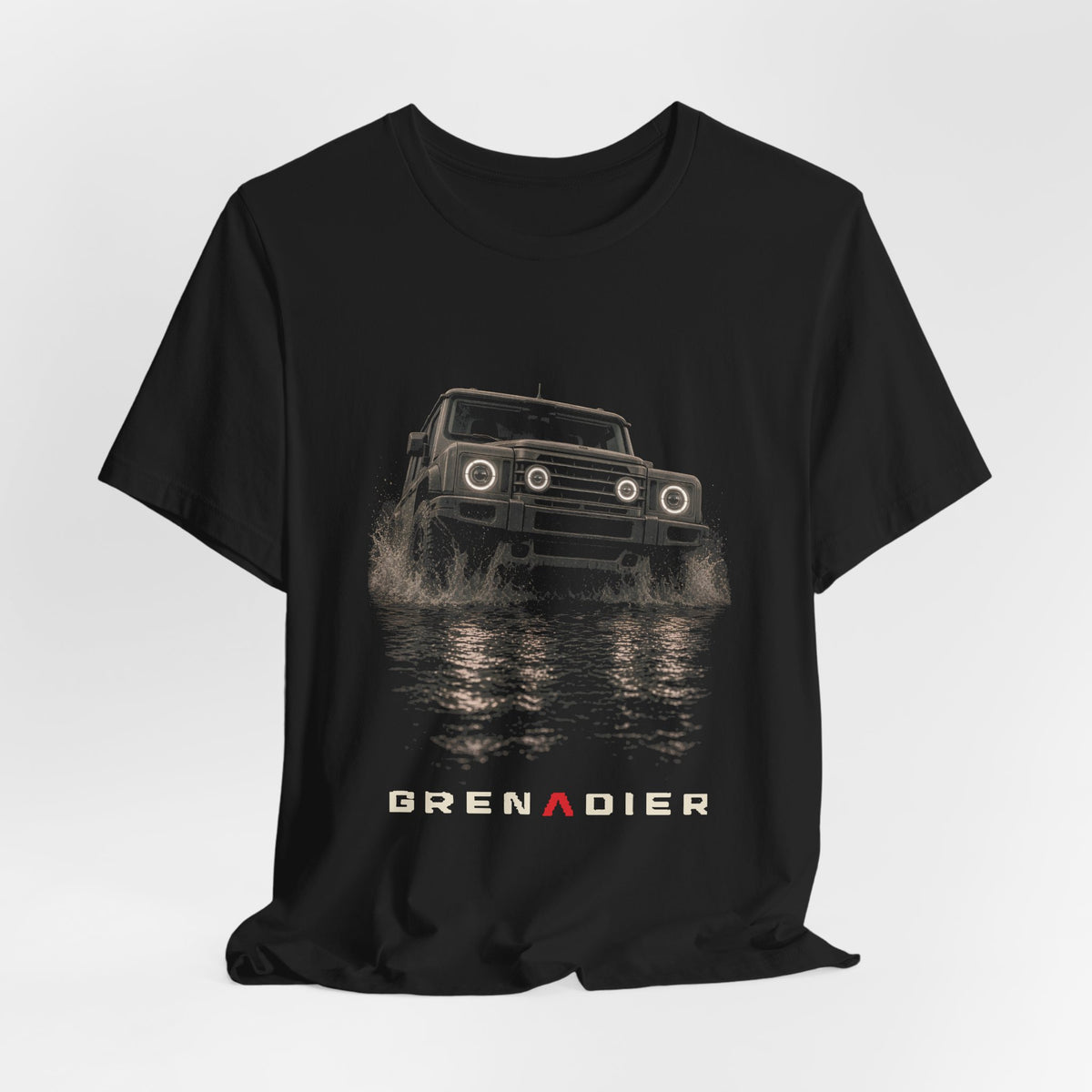 Black tee, front print: 4x4 wading dark water at night, headlights on (angled three-quarter view) under GRENADIER wordmark – view 3
