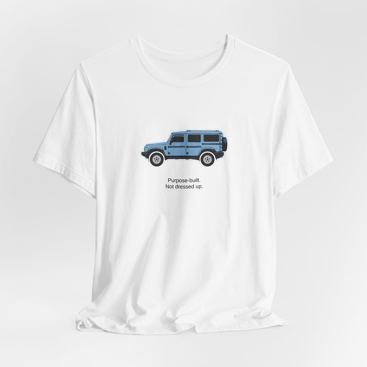 Tee: Eldoret Blue boxy 4x4 in side profile on white field, "Purpose-built. Not dressed up." lettering under the truck – view 4